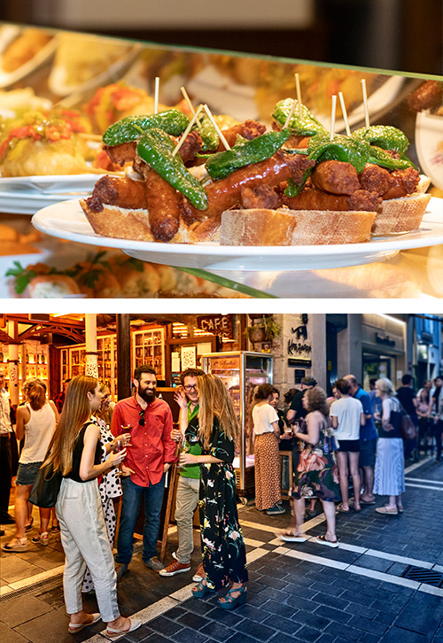Un pincho de txistorra y gente de pinchos en la calle San Nicolás de Pamplona | © Francis Vaquero y Diaporama · Turismo de Navarra<